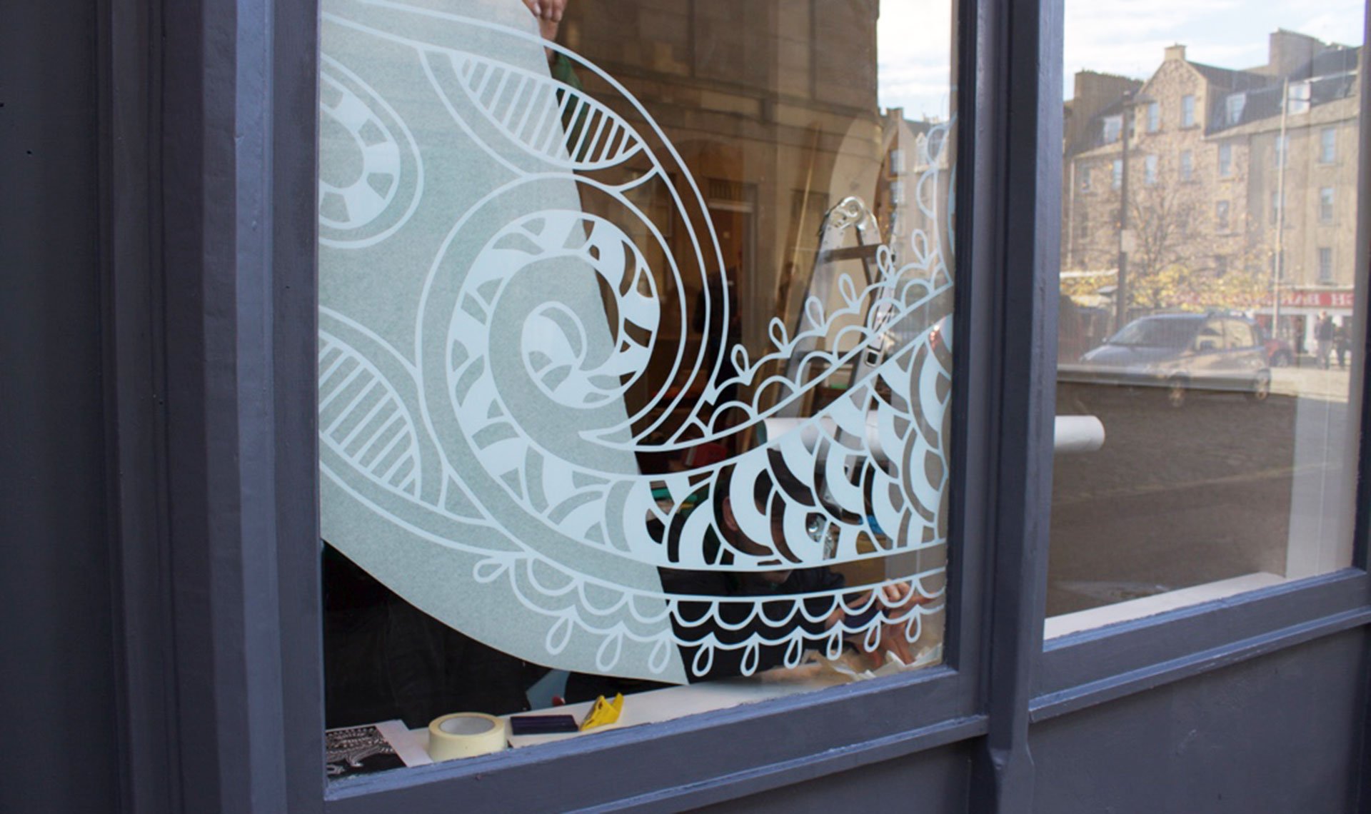 Bindi design painted on window inspired by henna artwork